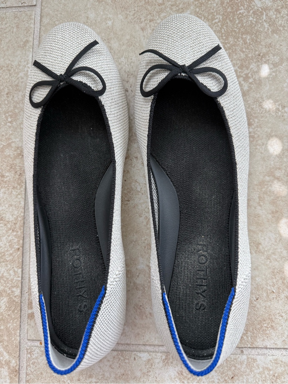 Rothy’s ballet flats with bow.